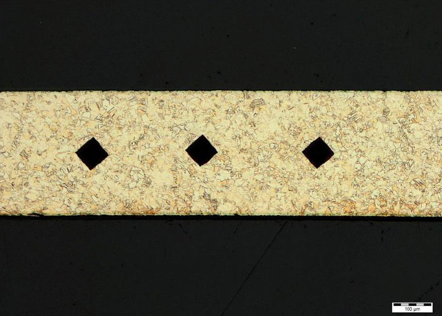 Figure 2.2 Microhardness indents in the cross section of the neck, 100x.